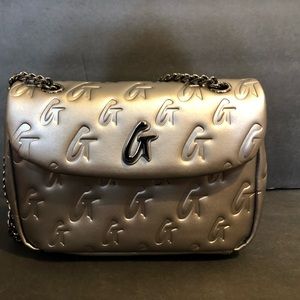 Glam-Aholic mini platinum monogram flap bag.